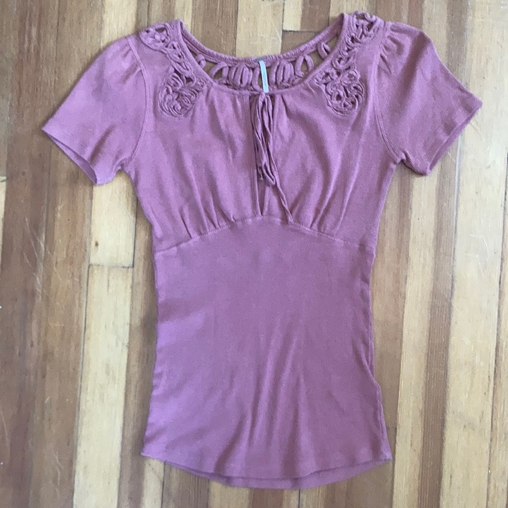 Super pretty Free People pink cutout top - size XS. Flattering fitted material